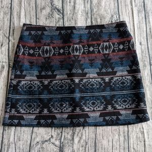 Kenar patterned wool mini skirt.